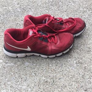 Red Nike tennis shoes